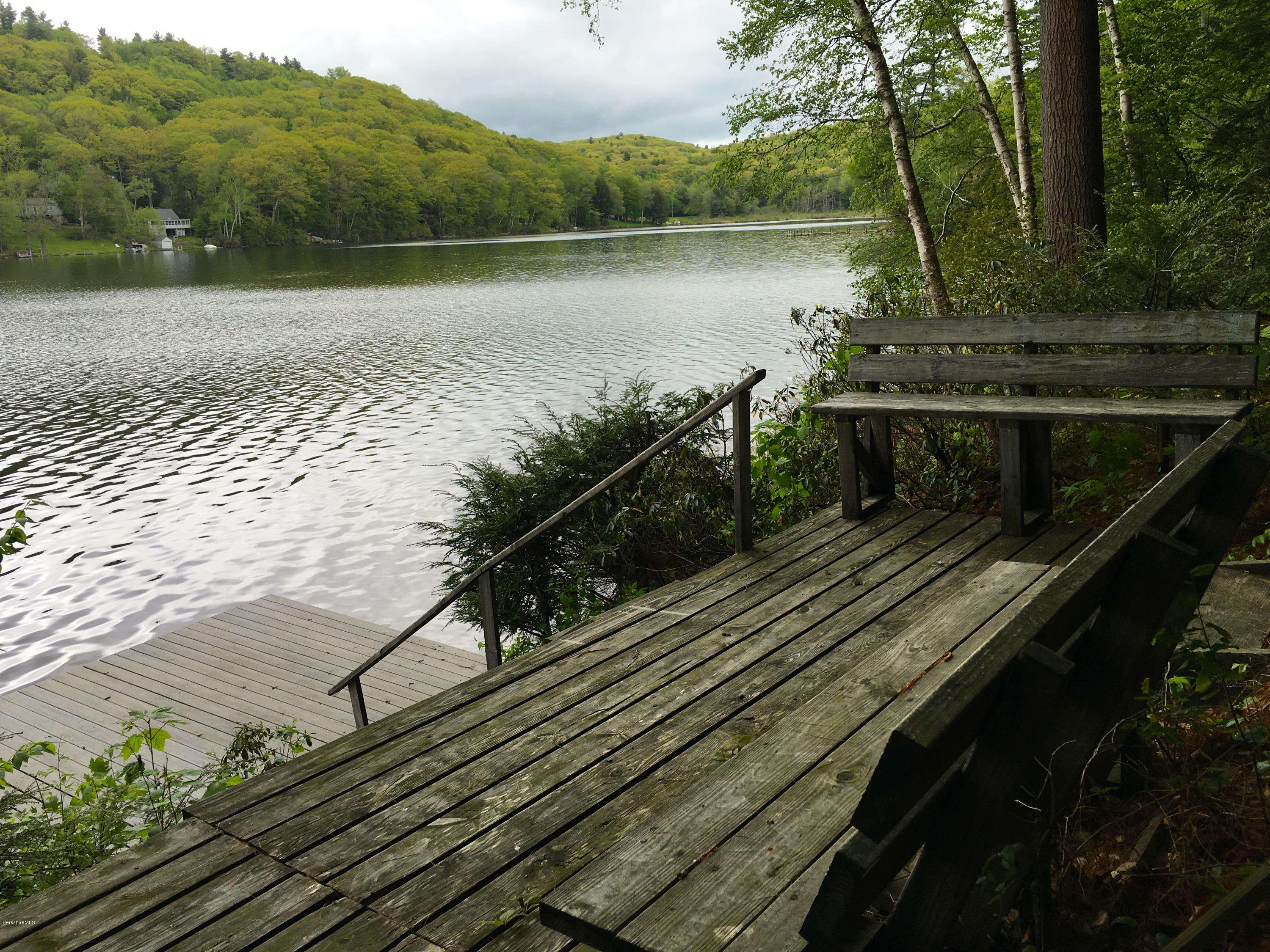 26 Bidwell Road Monterey, MA 01245 - Photo 15 of 17 a view of a balcony with wooden floor and lake view