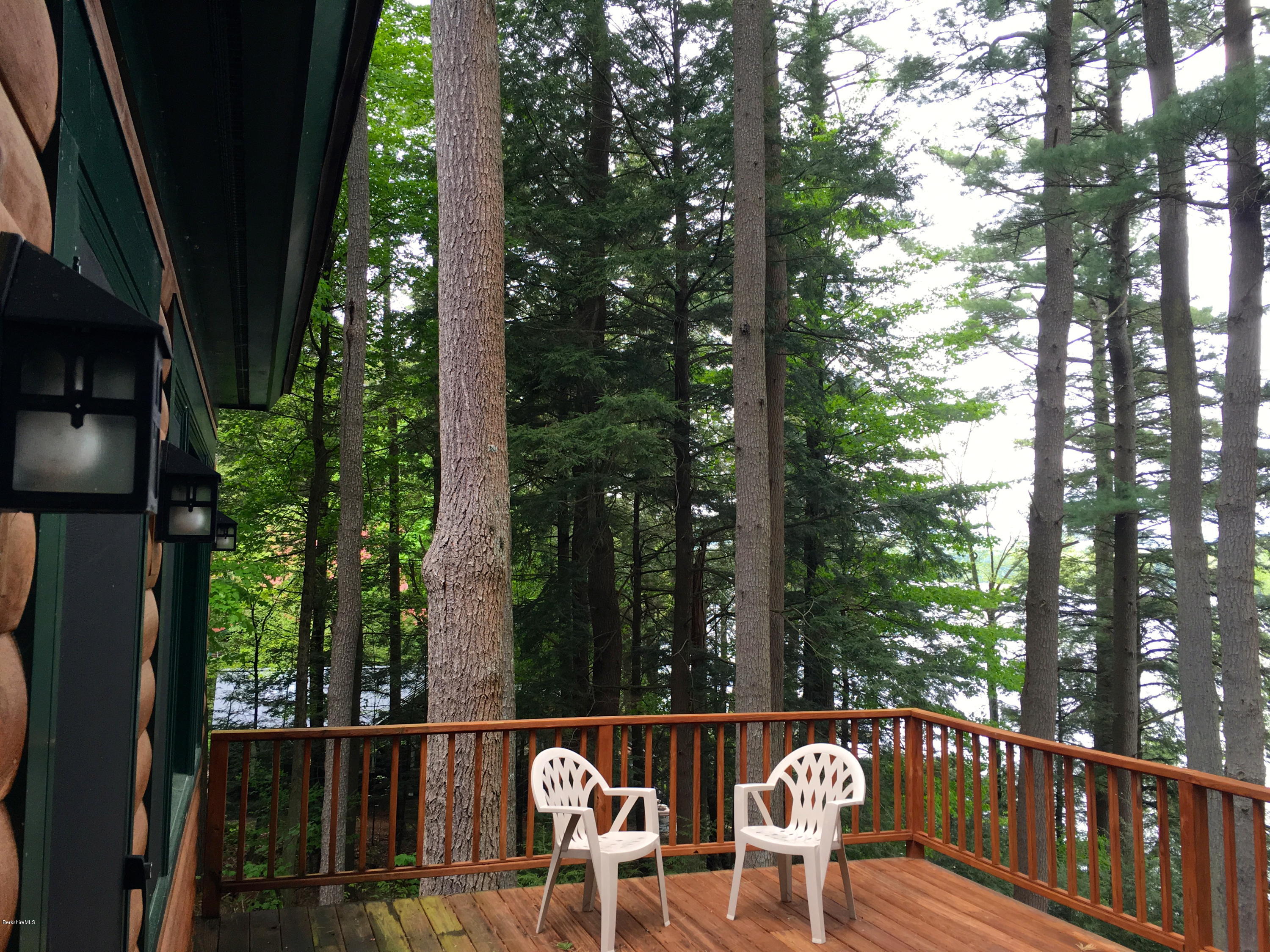 26 Bidwell Road Monterey, MA 01245 - Photo 6 of 17 a view of a chair and table in the balcony