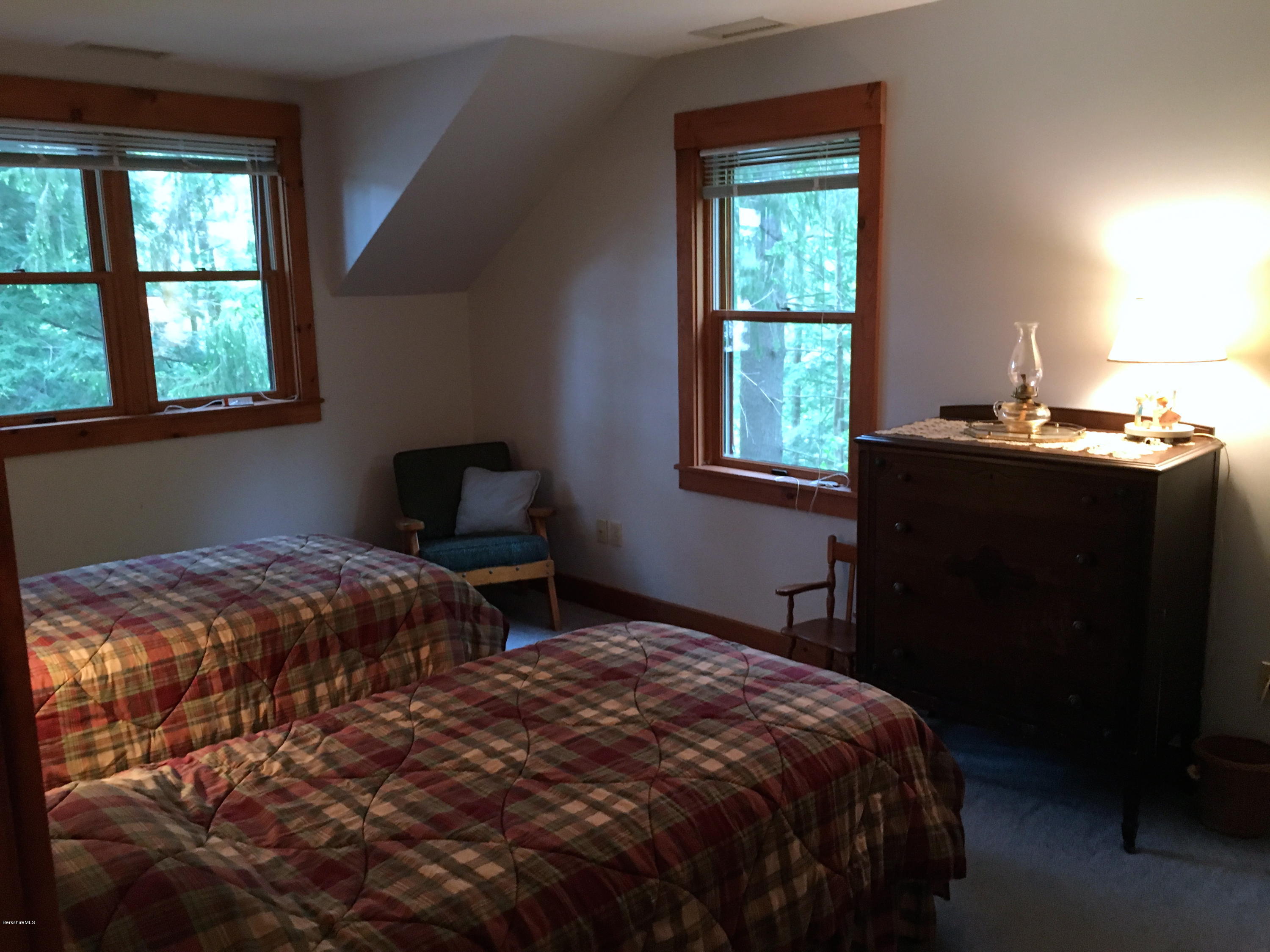 26 Bidwell Road Monterey, MA 01245 - Photo 10 of 17 a bedroom with a bed and a window