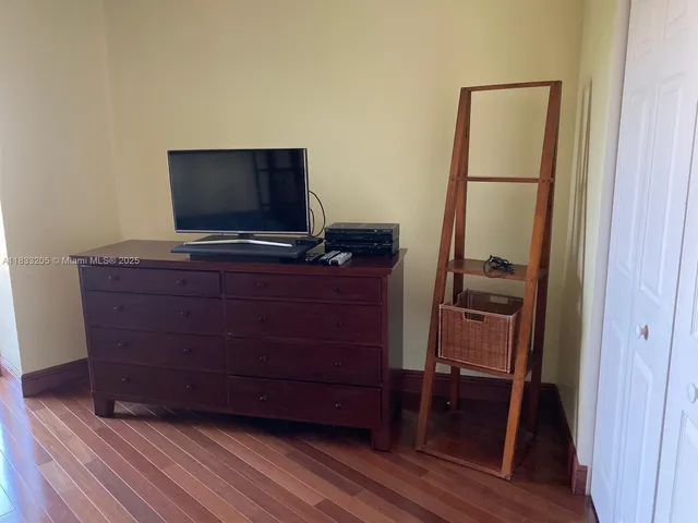 a room with furniture and flat screen tv