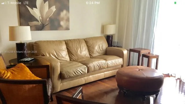 a living room with furniture and a lamp