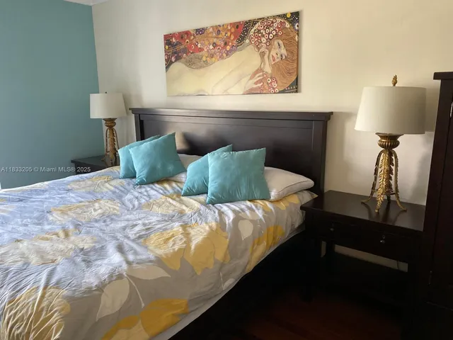 a bedroom with bed and window