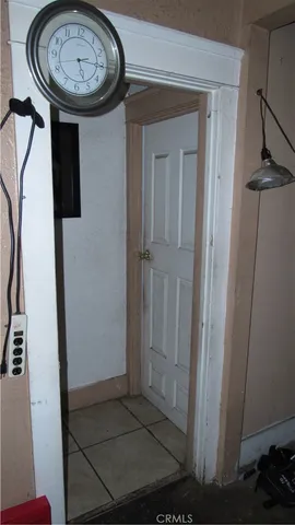 a view of a patio with table and chairs potted plants