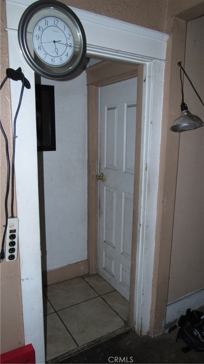 1195 Wisconsin Street Pomona, CA 91768 - Photo 9 of 15 a view of a hallway with a wooden door