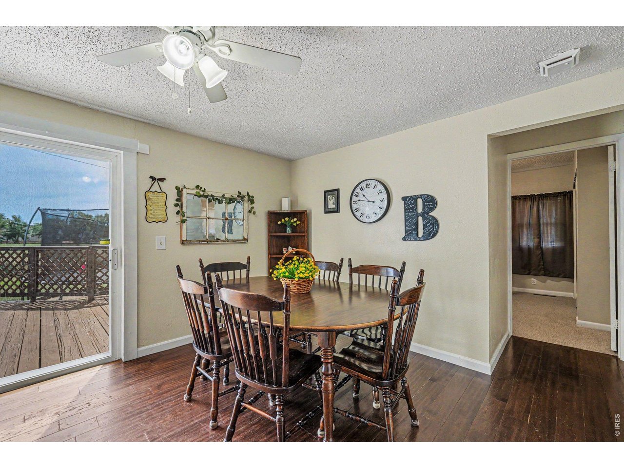 1430 30th Street Road Greeley, CO 80631 - Photo 5 of 22 a view of a dining room with furniture and wooden floor