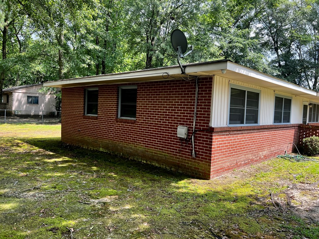 850 Brighton Road Columbus, GA 31906 - Photo 13 of 13 a view of a backyard with a large tree