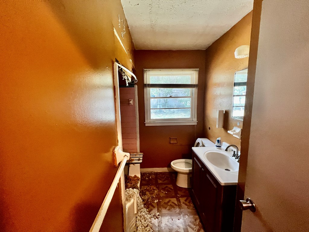 850 Brighton Road Columbus, GA 31906 - Photo 7 of 13 a bathroom with a sink toilet and a mirror