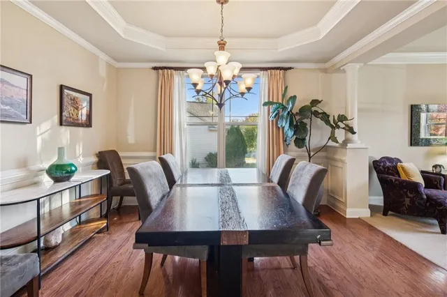 a view of a dining room with furniture window and wooden floor
