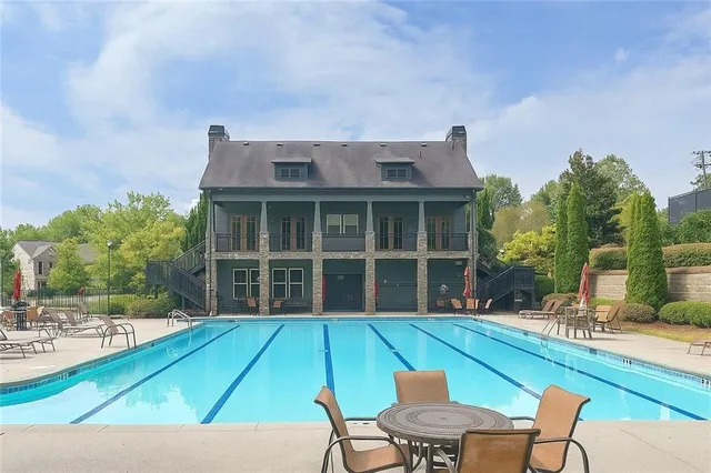 a view of a backyard with a sitting area and furniture