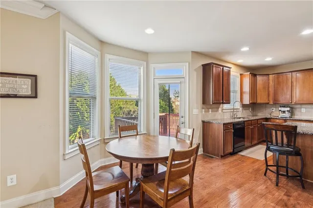 a kitchen with a table and chairs in it