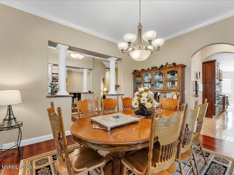 1120 Zolezzi Lane Reno, NV 89511 - Photo 14 of 48 a view of a dining room with furniture and wooden floor