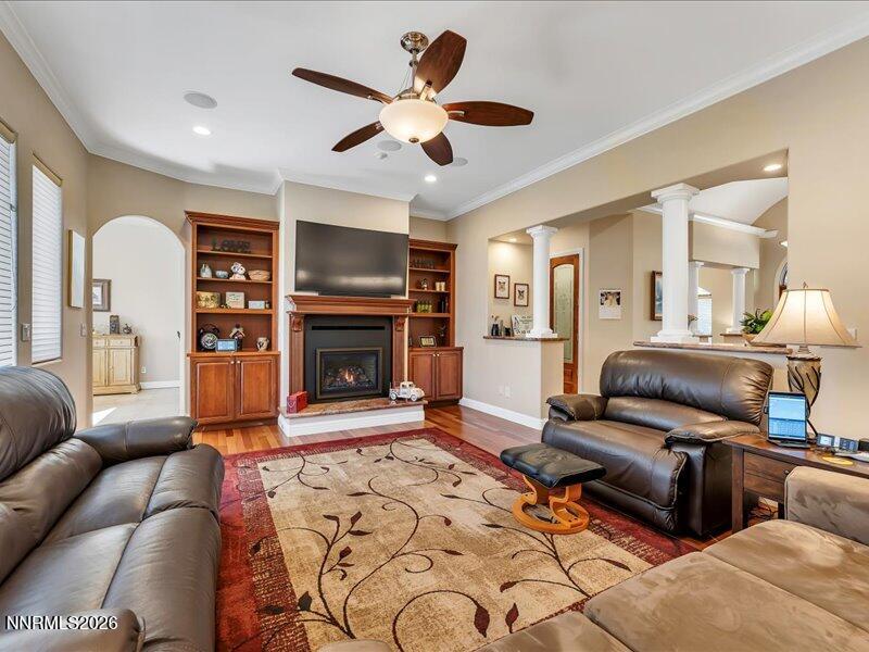 1120 Zolezzi Lane Reno, NV 89511 - Photo 18 of 48 a living room with furniture a flat screen tv and a fireplace