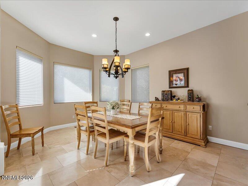 1120 Zolezzi Lane Reno, NV 89511 - Photo 19 of 48 a view of a dining room with furniture and chandelier