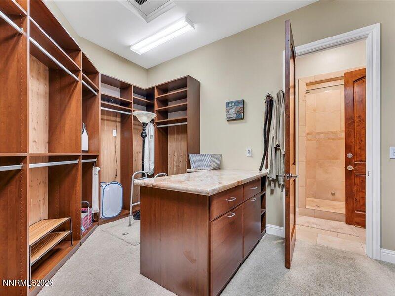1120 Zolezzi Lane Reno, NV 89511 - Photo 27 of 48 a kitchen with stainless steel appliances granite countertop a refrigerator and a sink