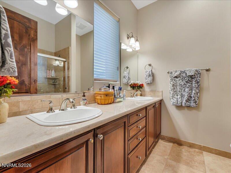 1120 Zolezzi Lane Reno, NV 89511 - Photo 31 of 48 a bathroom with a sink double vanity and a mirror