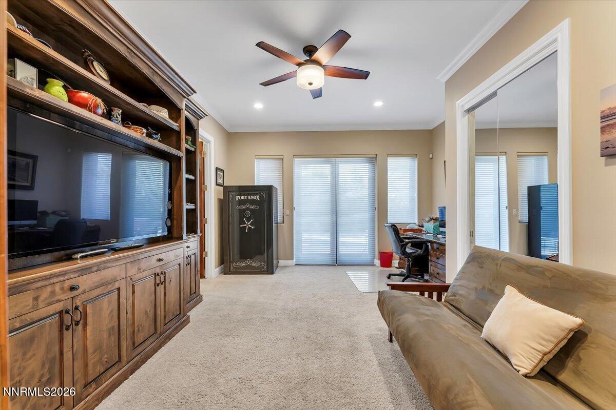1120 Zolezzi Lane Reno, NV 89511 - Photo 34 of 48 a living room with furniture and a flat screen tv
