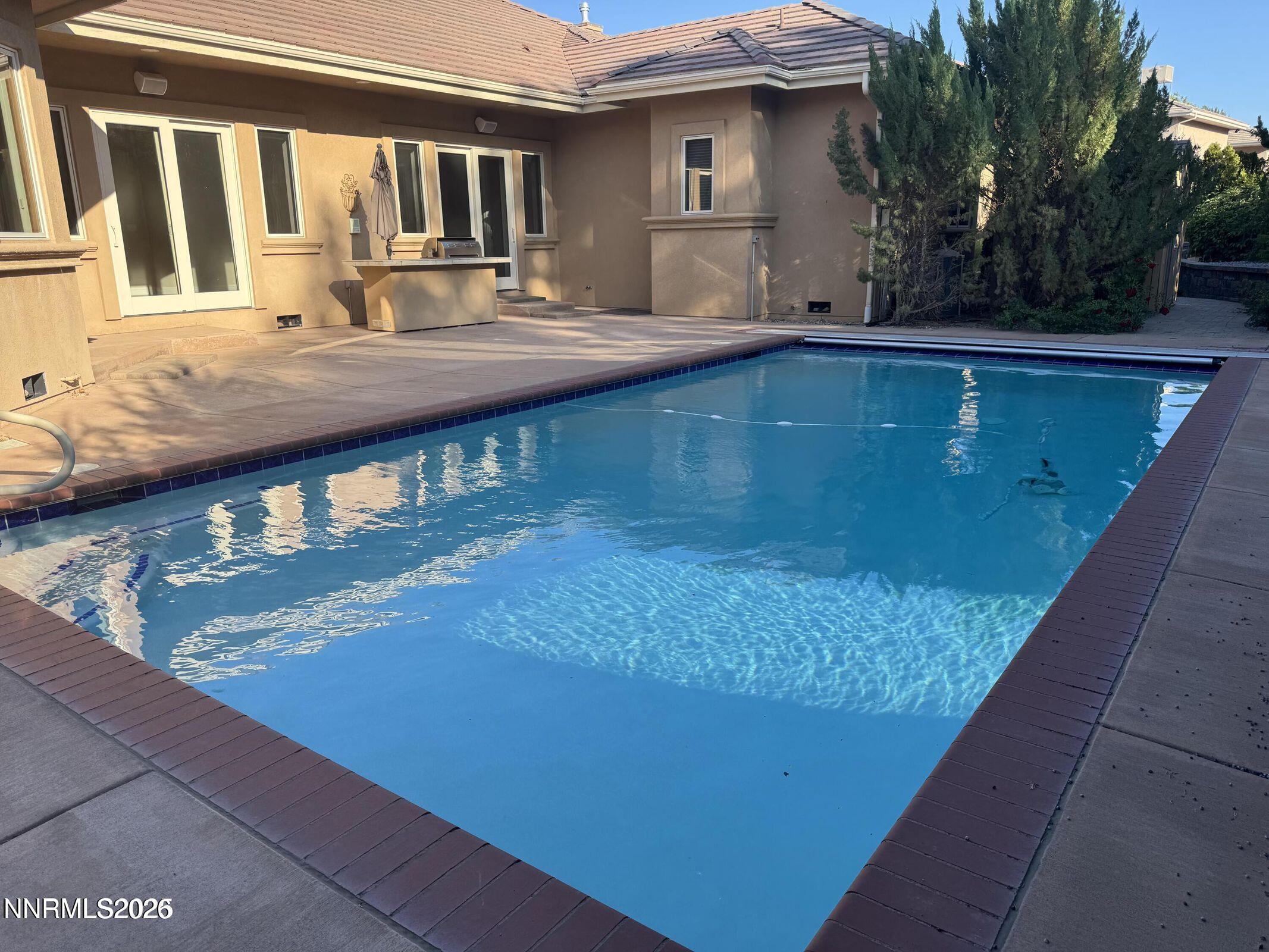1120 Zolezzi Lane Reno, NV 89511 - Photo 10 of 48 a view of swimming pool with outdoor seating