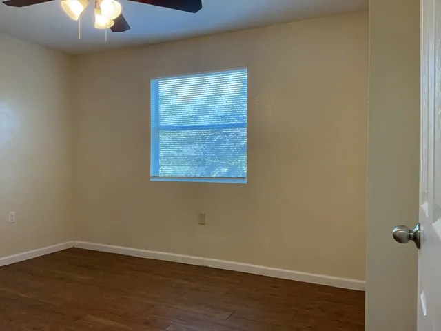 an empty room with a hardwood