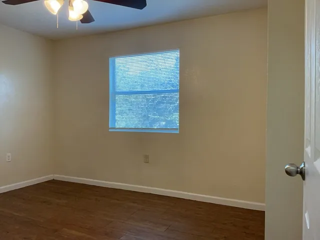 an empty room with a hardwood