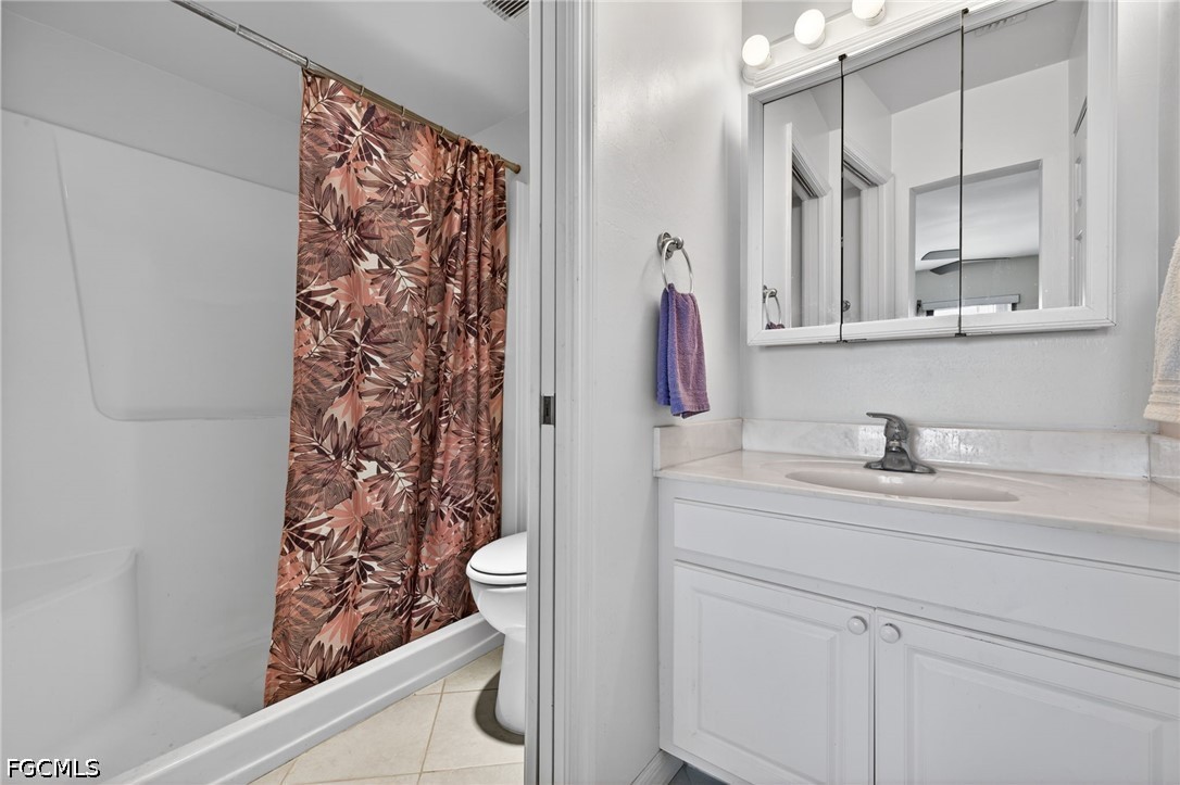 200 Lenell Road, Unit 222 Fort Myers Beach, FL 33931 - Photo 12 of 33 a bathroom with a sink and a mirror