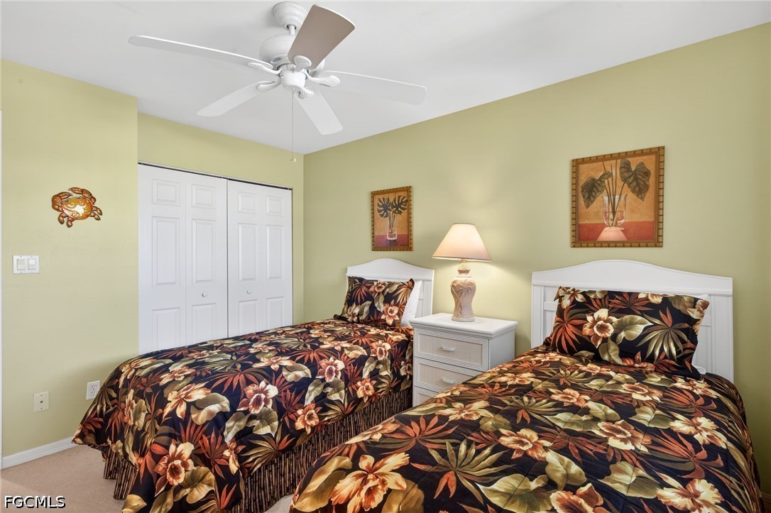 200 Lenell Road, Unit 222 Fort Myers Beach, FL 33931 - Photo 14 of 33 a bedroom with two beds and a lamp