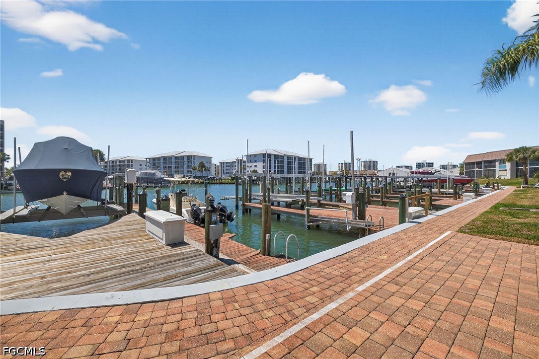 200 Lenell Road, Unit 222 Fort Myers Beach, FL 33931 - Photo 20 of 33 a view of a swimming pool and lounge chair