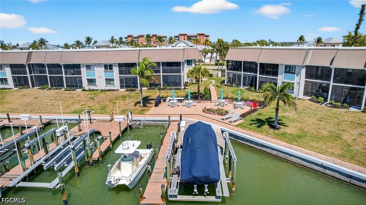 200 Lenell Road, Unit 222 Fort Myers Beach, FL 33931 - Photo 27 of 33 a view of swimming pool with outdoor seating and city view