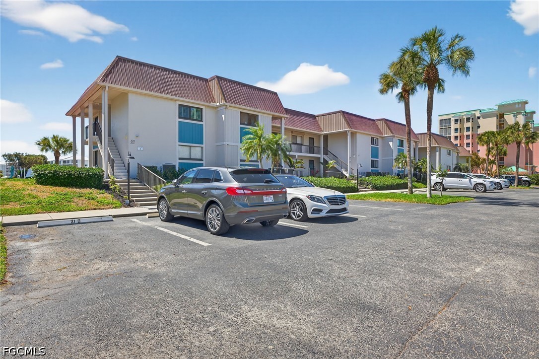 200 Lenell Road, Unit 222 Fort Myers Beach, FL 33931 - Photo 32 of 33 a car parked in front of a house