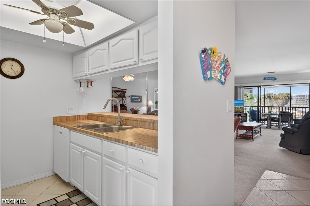 200 Lenell Road, Unit 222 Fort Myers Beach, FL 33931 - Photo 7 of 33 a hallway with a sink and cabinets