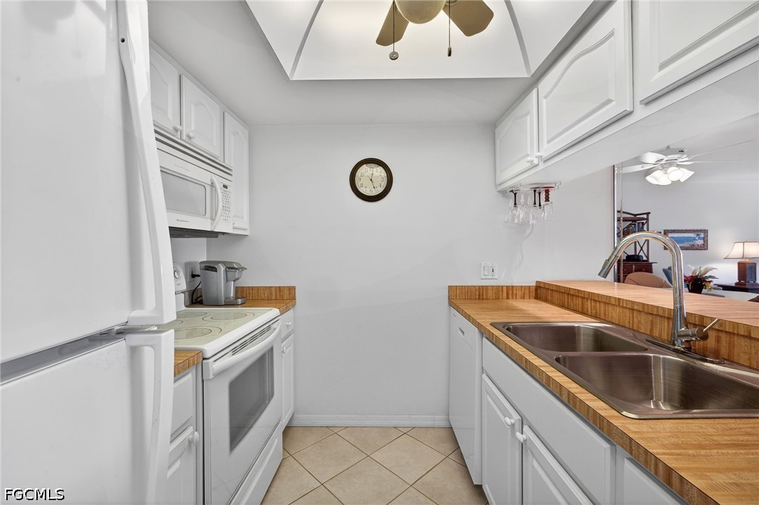 200 Lenell Road, Unit 222 Fort Myers Beach, FL 33931 - Photo 8 of 33 a kitchen with stainless steel appliances granite countertop a sink and stove