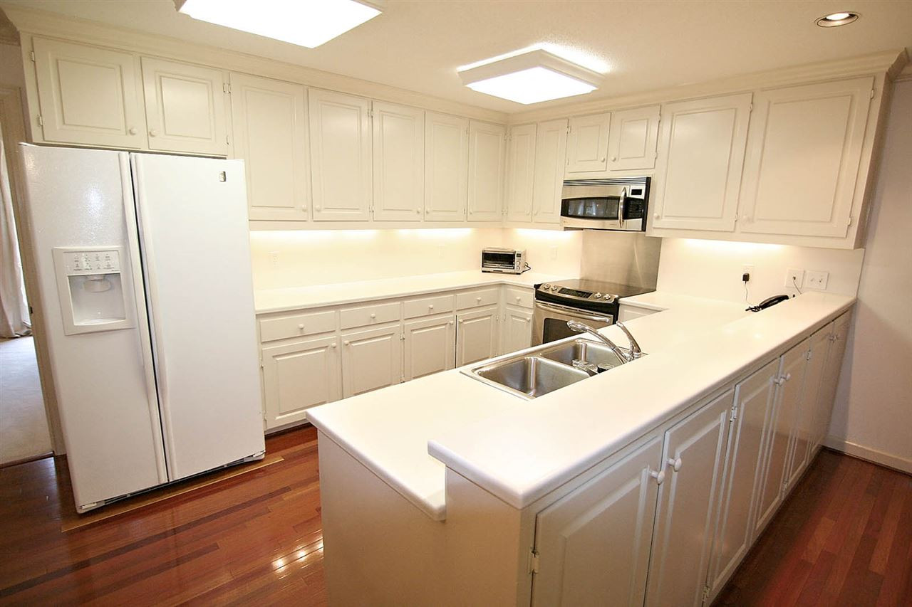 8005 Shellnut Road Raleigh, NC 27615 - Photo 9 of 25 Kitchen has Clean Lines -- Stainless Steel Appliances include a Bosch Dishwasher. There is Instant Hot Water at Kitchen Sink. Kitchen
