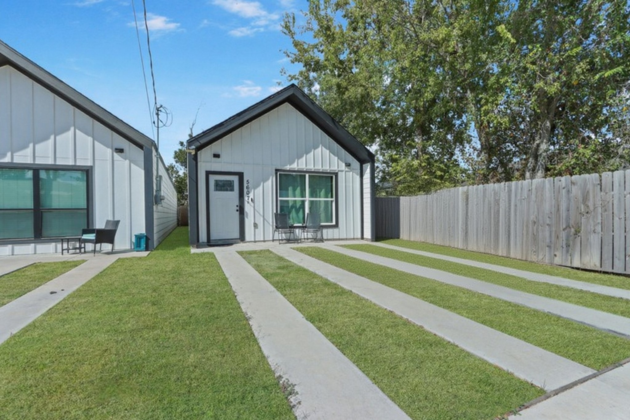 a view of a house with a backyard and patio