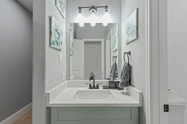 a bathroom with a sink and a mirror