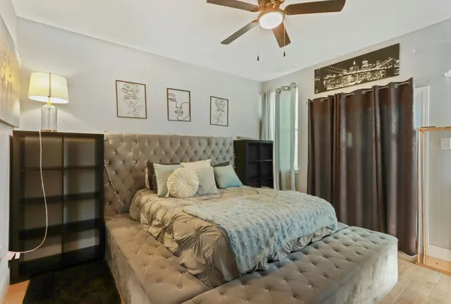 a bedroom with a bed and a window