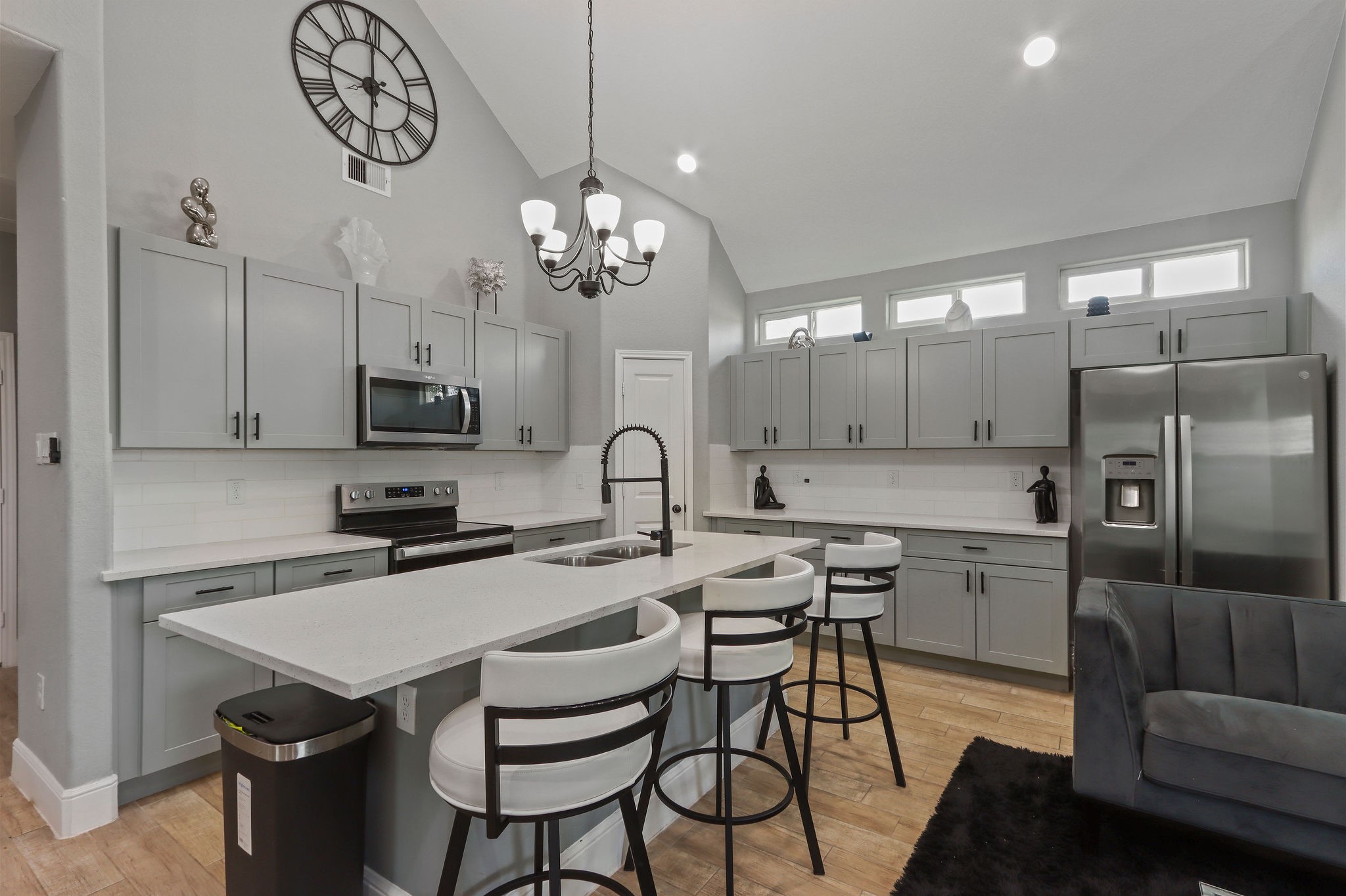 5607 Bacher Street, Unit B Houston, TX 77028 - Photo 6 of 22 a kitchen that has a table chairs and stainless steel appliances