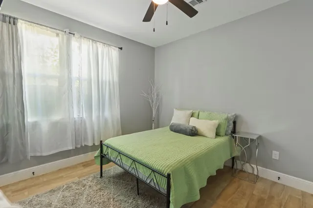 a bedroom with a bed and a table in it