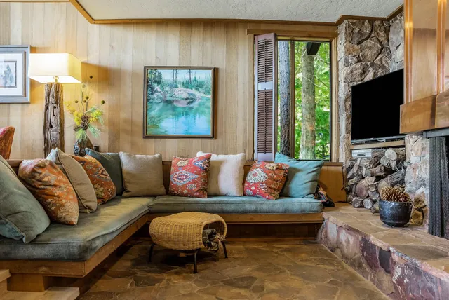 a living room with furniture fireplace and a flat screen tv
