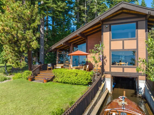 a front view of house with a garden and patio
