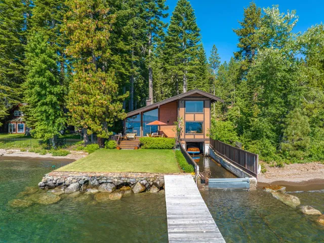 a pathway of a house with a yard