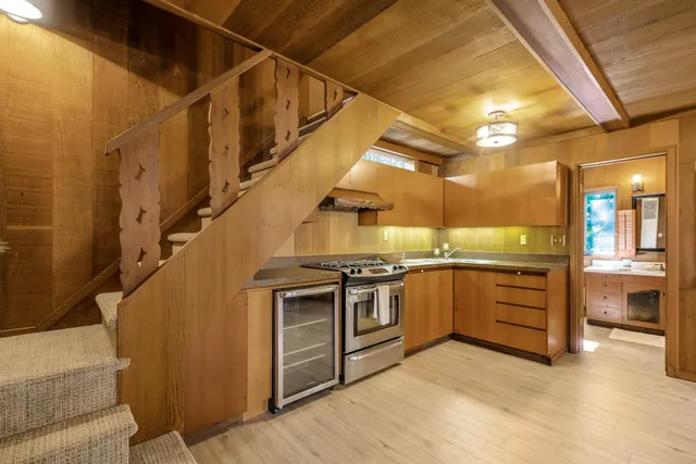 a kitchen with stainless steel appliances granite countertop a stove and a refrigerator