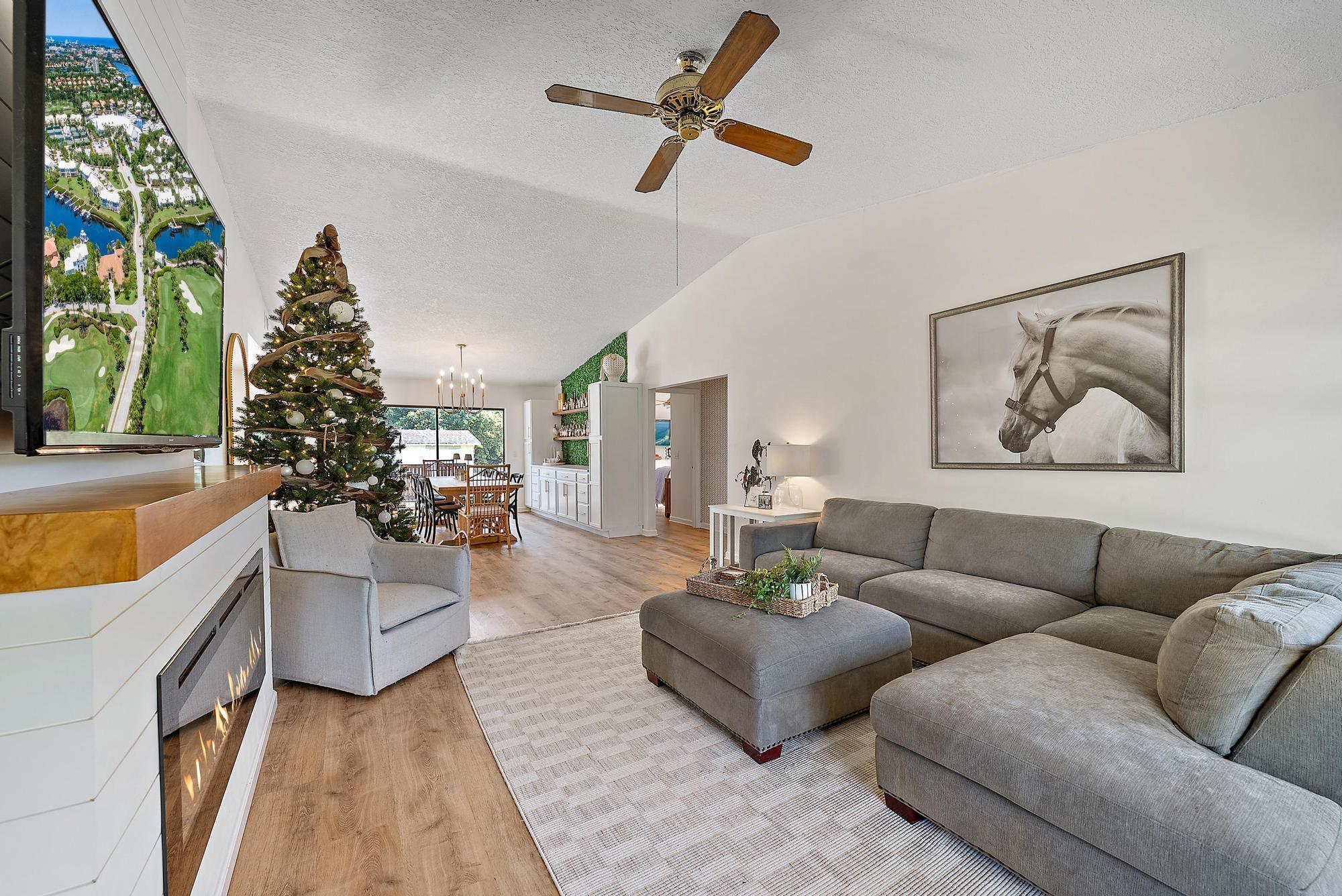 16766 123rd Terrace North Jupiter, FL 33478 - Photo 11 of 26 a living room with furniture and a large window