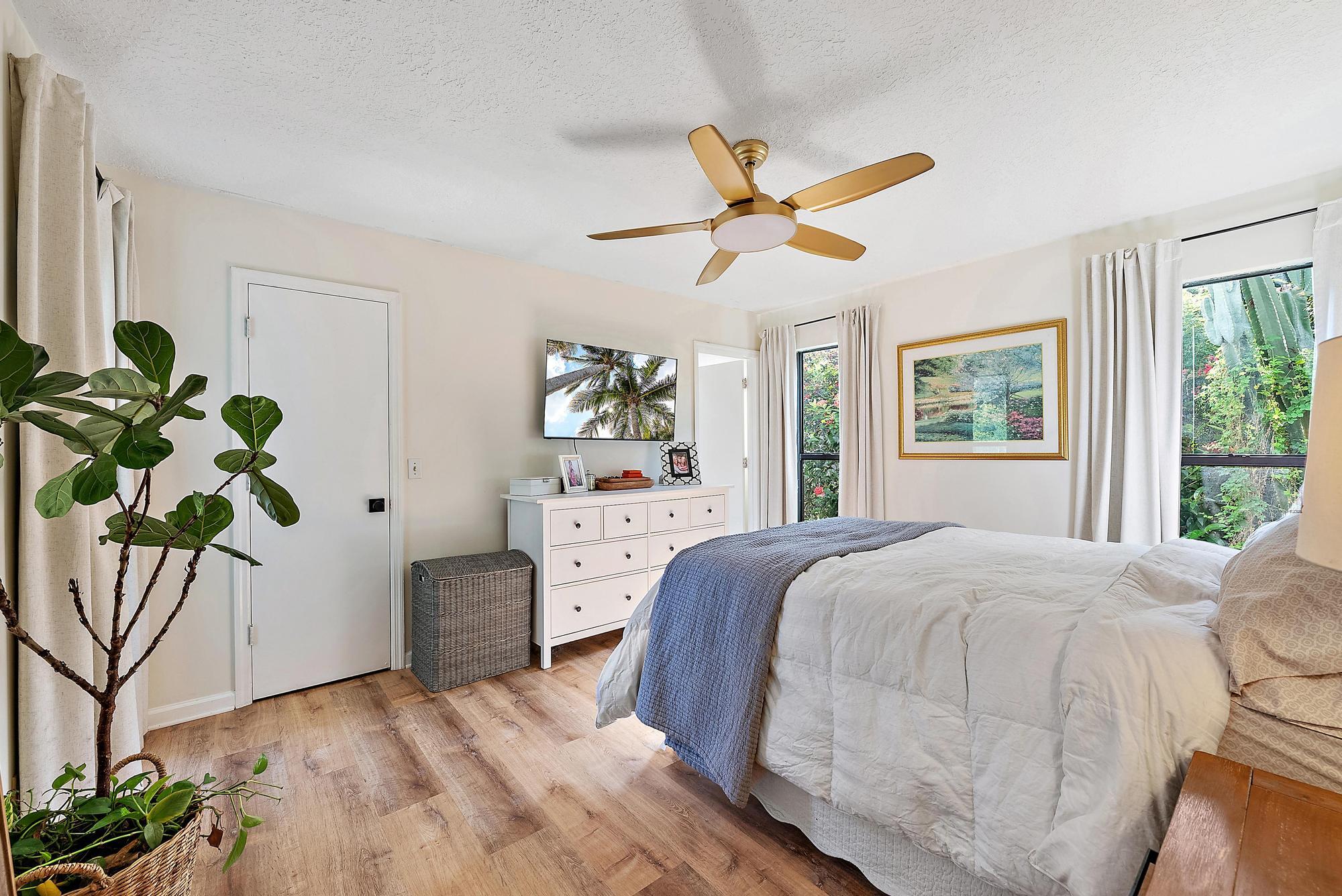 16766 123rd Terrace North Jupiter, FL 33478 - Photo 12 of 26 a bedroom with a bed dresser and a window