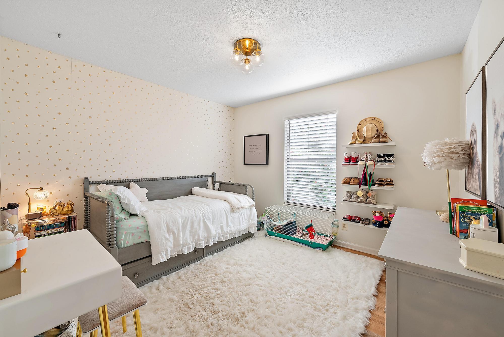 16766 123rd Terrace North Jupiter, FL 33478 - Photo 16 of 26 a bedroom with furniture and a window