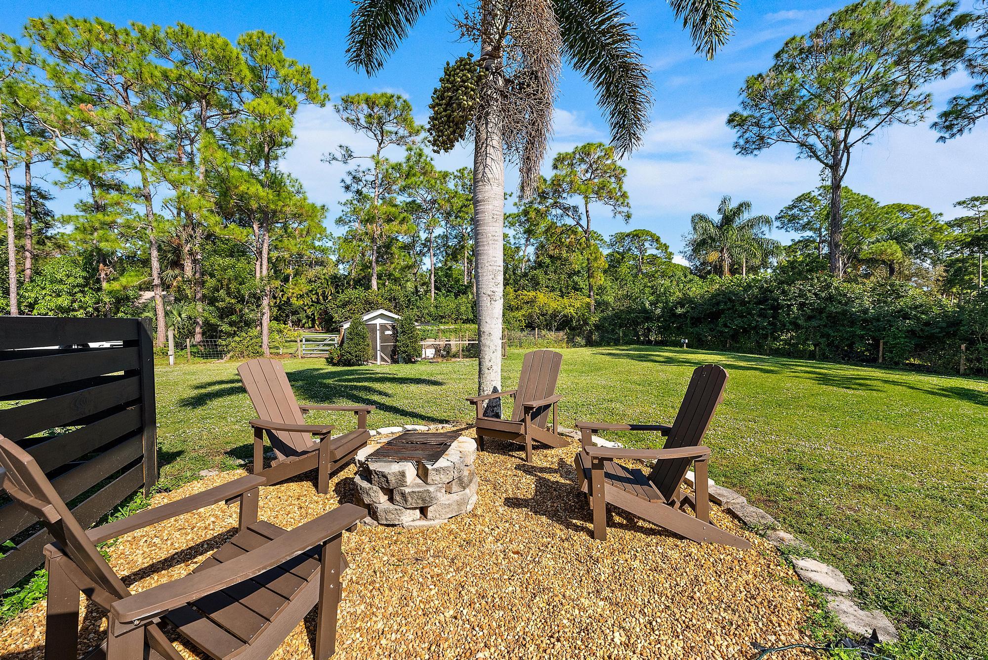 16766 123rd Terrace North Jupiter, FL 33478 - Photo 20 of 26 a view of a lounge chairs in the garden