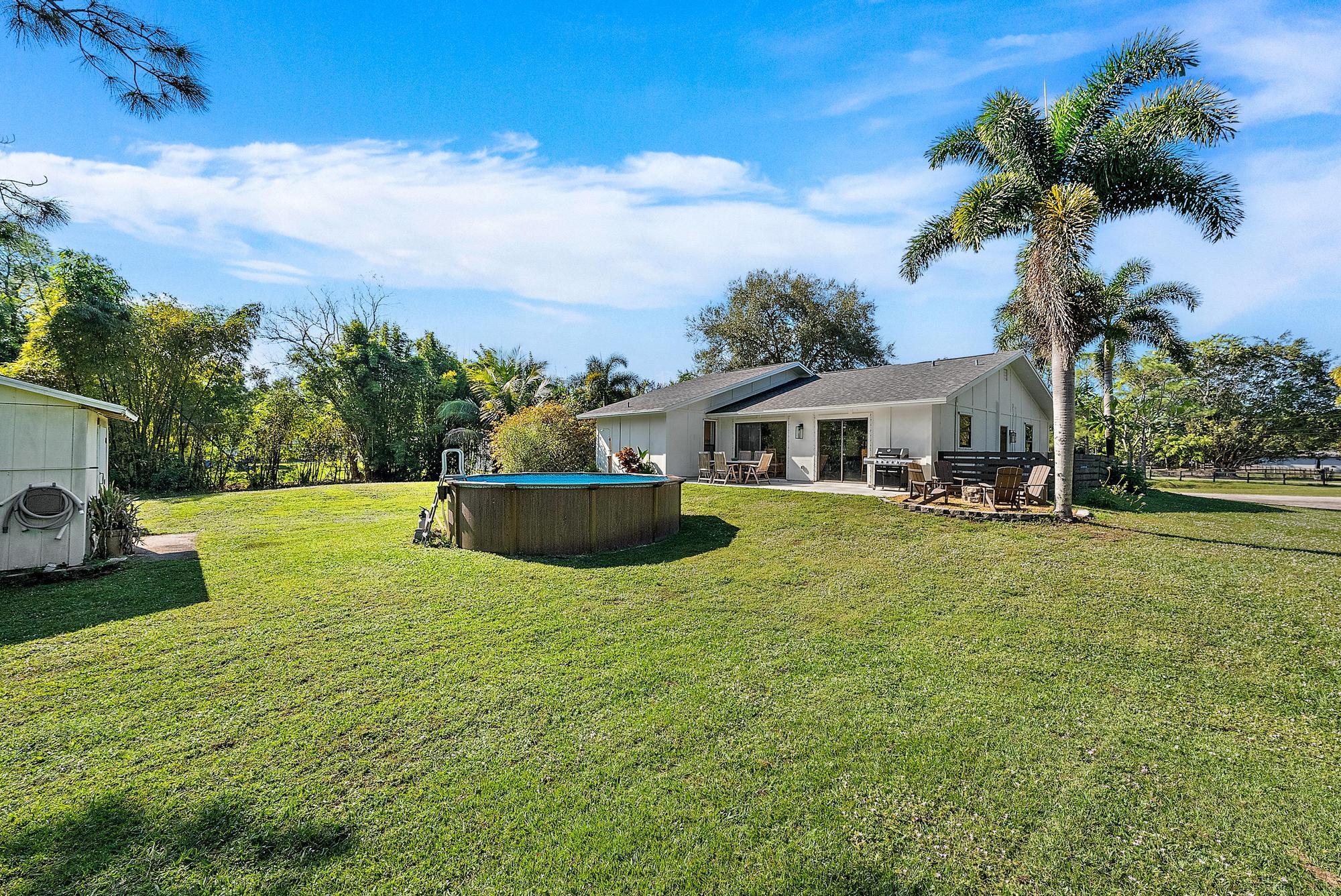 16766 123rd Terrace North Jupiter, FL 33478 - Photo 21 of 26 a view of house with yard and entertaining space