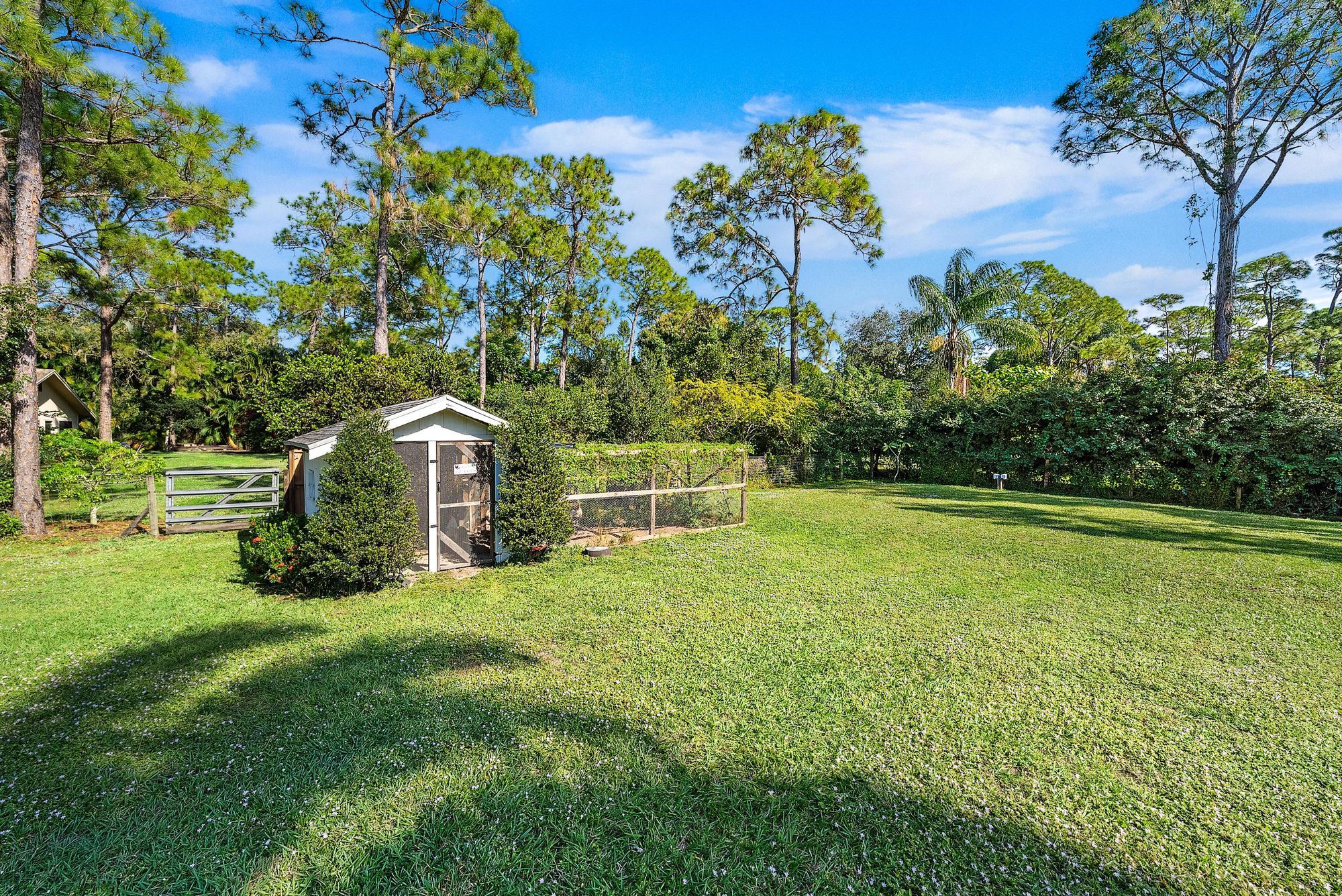 16766 123rd Terrace North Jupiter, FL 33478 - Photo 22 of 26 a view of a house with a yard