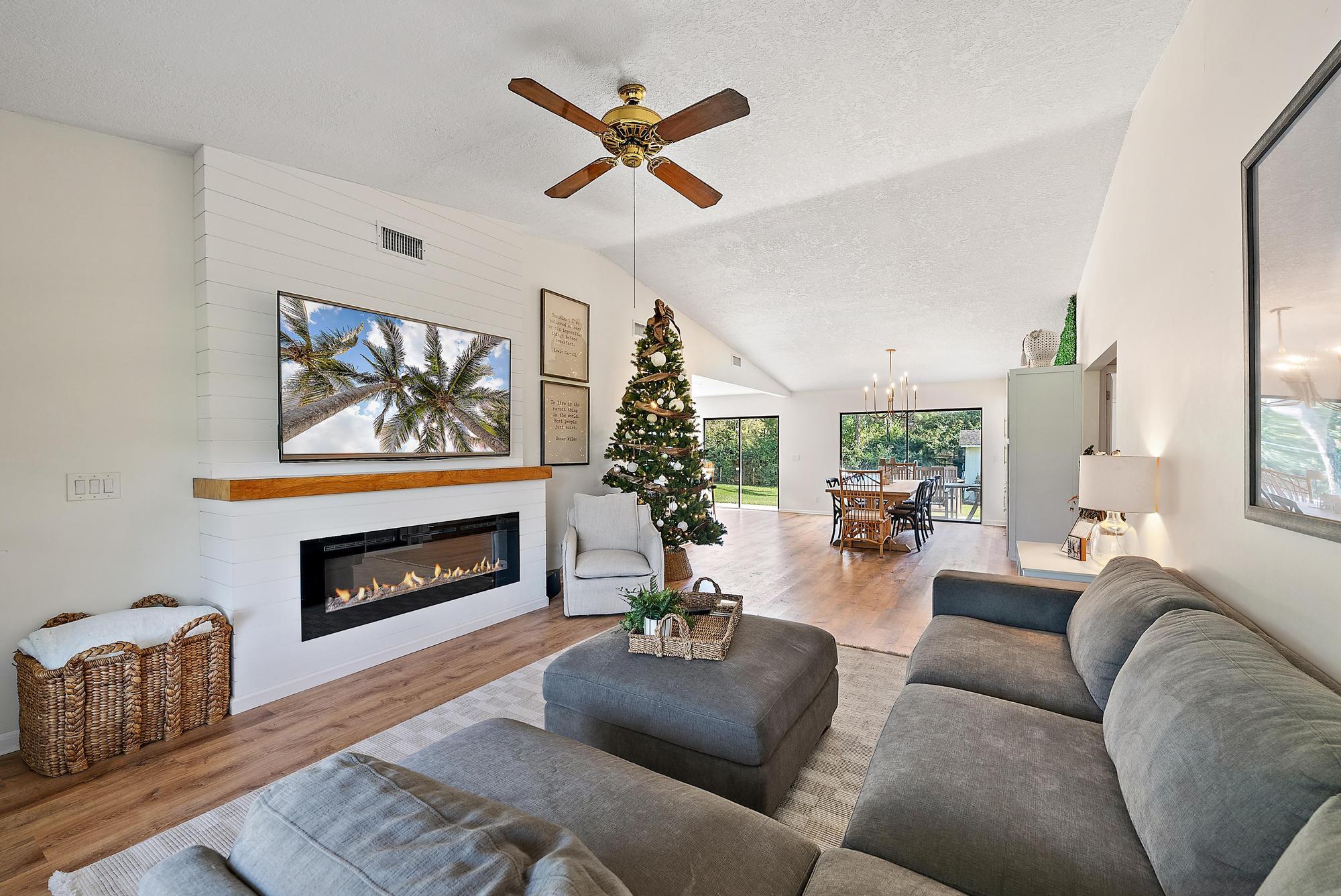 16766 123rd Terrace North Jupiter, FL 33478 - Photo 10 of 26 a living room with furniture fireplace and wooden floor