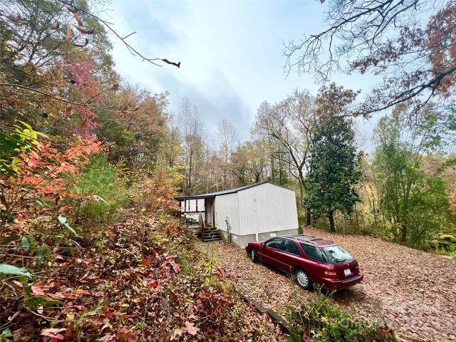 a view of a backyard with sitting area