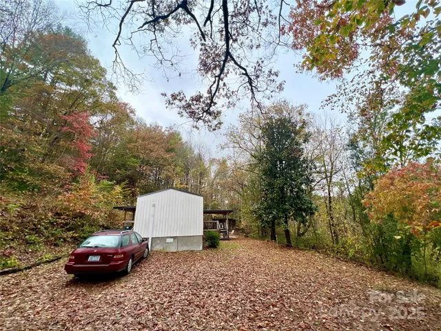 a car parked in front of a white house