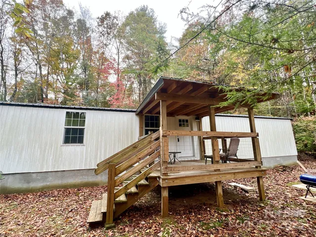 a house view with a sitting space and garden